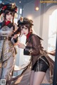 A couple of women dressed in military uniforms standing next to each other.